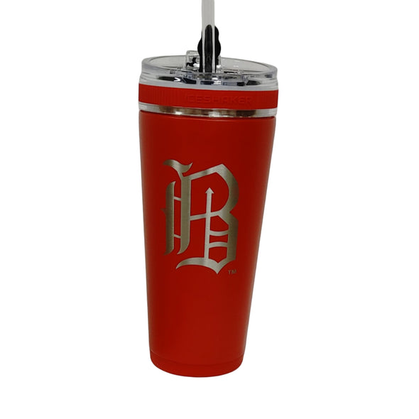 Red tumbler with a logo on a white surface